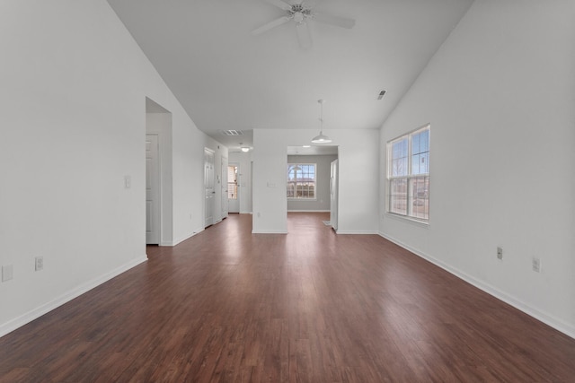 unfurnished living room featuring dark hardwood / wood-style flooring, high vaulted ceiling, and ceiling fan