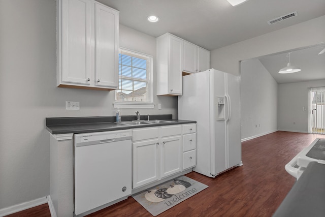 kitchen with sink, white cabinets, and white appliances