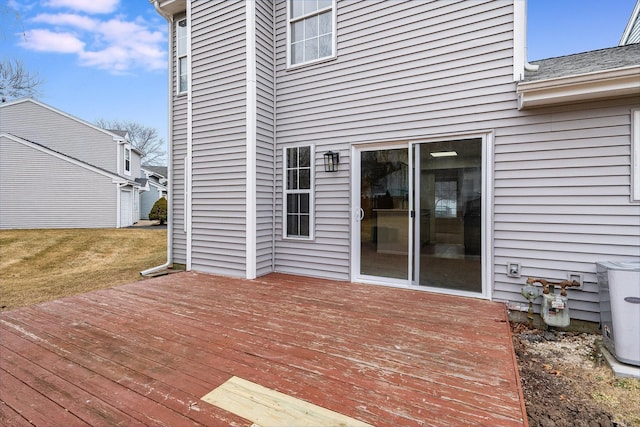 wooden deck with a lawn