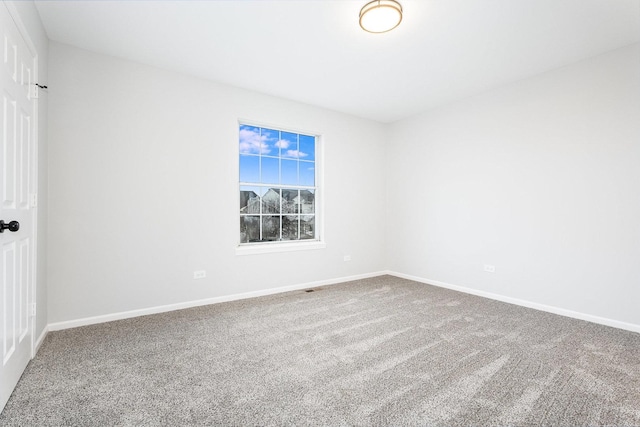 spare room featuring carpet floors