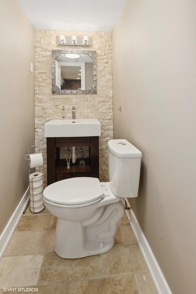 bathroom featuring sink and toilet