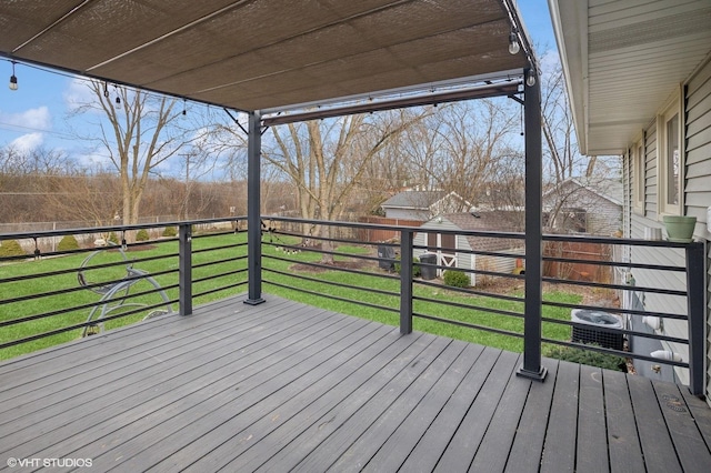 wooden terrace with a lawn