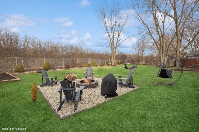 view of yard featuring a fire pit