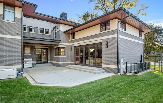6505 N Knox Ave, Lincolnwood, IL 60645 - back of property featuring a lawn, a patio, a balcony, fence, and brick siding