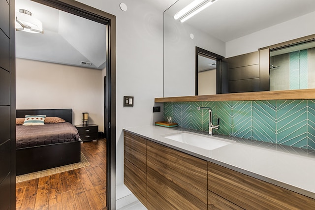 6505 N Knox Ave, Lincolnwood, IL 60645 - bathroom with wood-type flooring, visible vents, and vanity