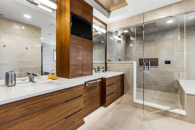 6505 N Knox Ave, Lincolnwood, IL 60645 - full bath with a sink, a shower stall, double vanity, and tile walls