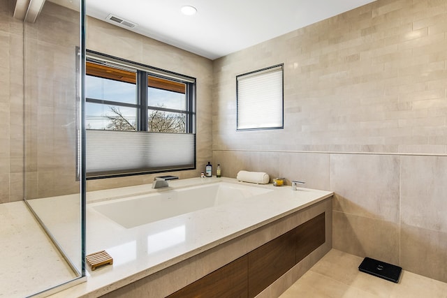 6505 N Knox Ave, Lincolnwood, IL 60645 - bathroom with visible vents and tile walls
