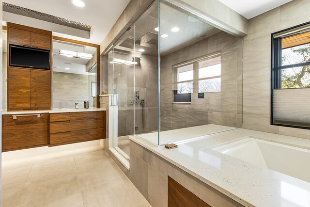 6505 N Knox Ave, Lincolnwood, IL 60645 - bathroom featuring a stall shower, tile walls, tile patterned flooring, vanity, and a bath