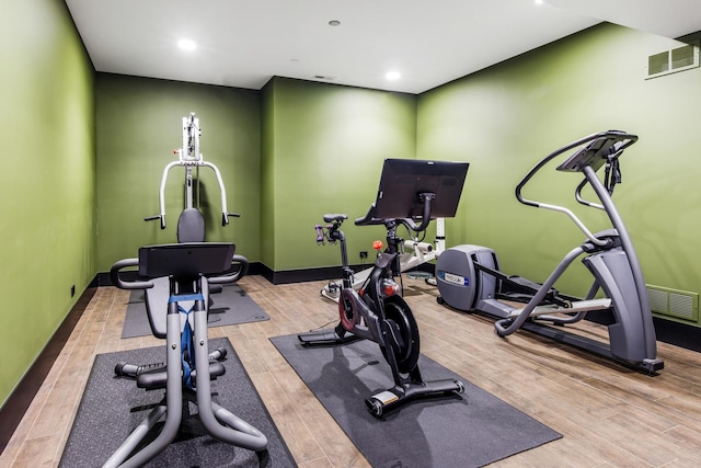 6505 N Knox Ave, Lincolnwood, IL 60645 - exercise area with recessed lighting, wood finished floors, visible vents, and baseboards