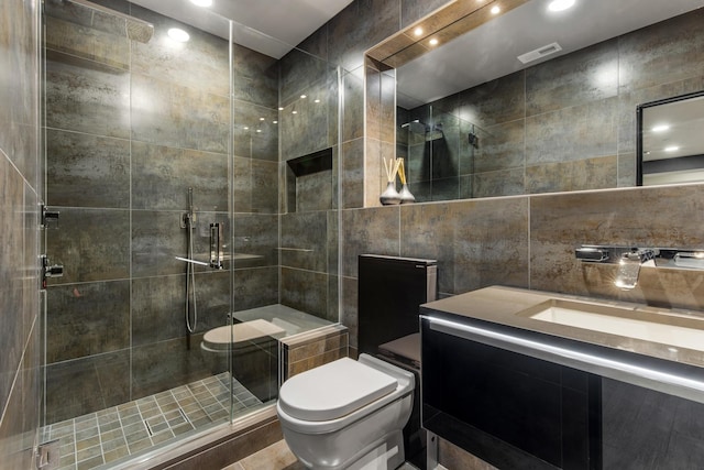 6505 N Knox Ave, Lincolnwood, IL 60645 - full bath featuring a stall shower, visible vents, toilet, vanity, and tile walls