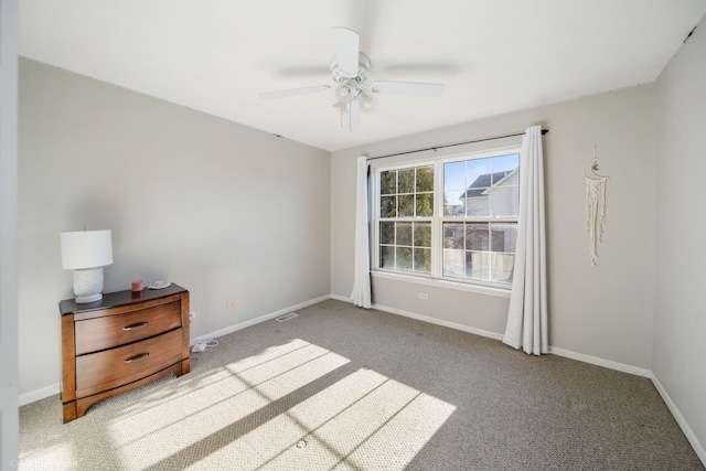 unfurnished bedroom featuring ceiling fan and light colored carpet