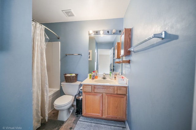 full bathroom featuring tile patterned floors, vanity, toilet, and shower / bath combo with shower curtain