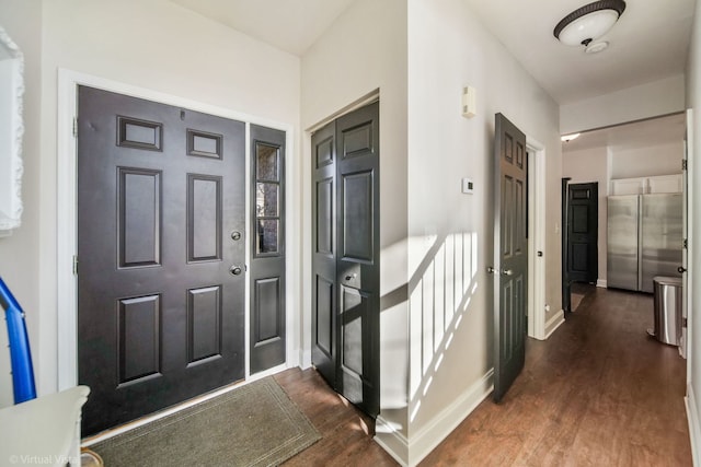 foyer with dark wood-type flooring