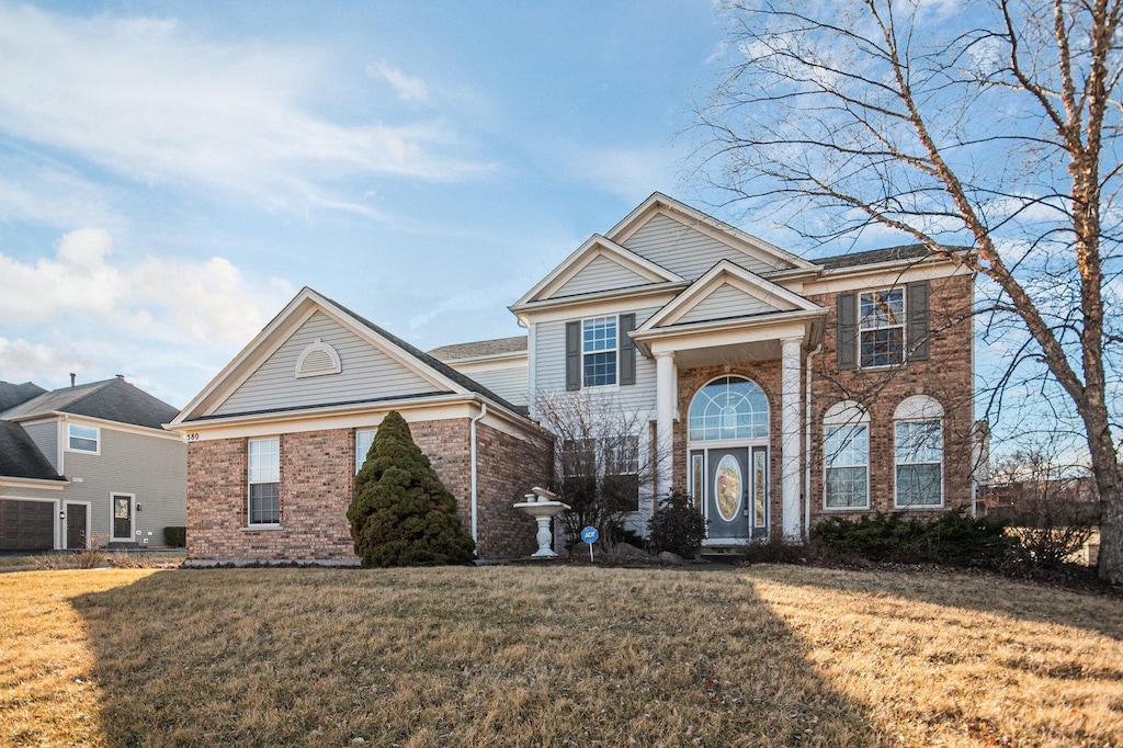 view of property with a front lawn