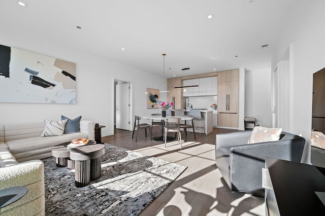 living room featuring wood finished floors and recessed lighting