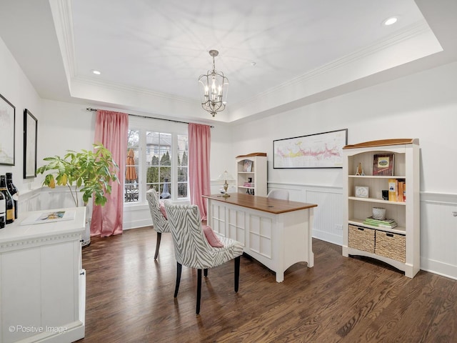 office featuring ornamental molding, dark hardwood / wood-style floors, an inviting chandelier, and a tray ceiling