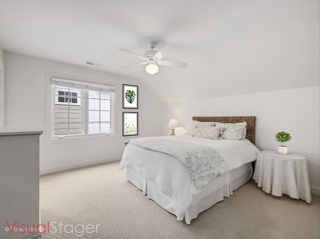 carpeted bedroom with lofted ceiling and ceiling fan