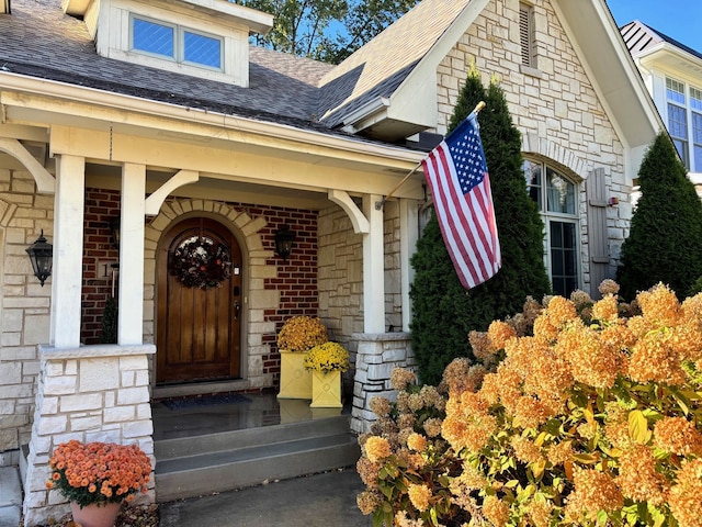 doorway to property featuring a porch