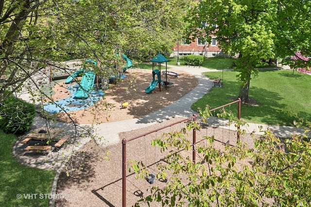 view of property's community featuring a yard