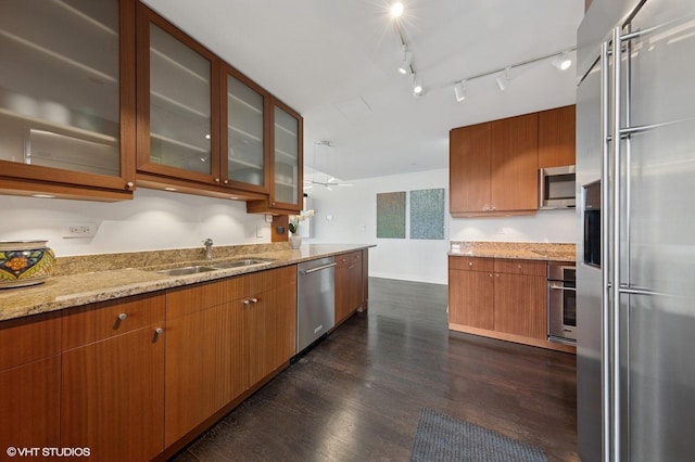 130 N Garland Ct Unit 4101, Chicago, IL 60602 - kitchen featuring appliances with stainless steel finishes, light stone counters, a sink, dark wood-style floors, and glass insert cabinets