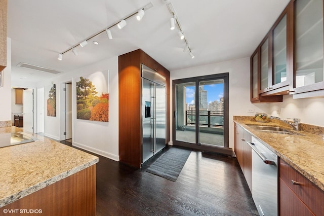 130 N Garland Ct Unit 4101, Chicago, IL 60602 - doorway with baseboards, dark wood finished floors, track lighting, and a sink