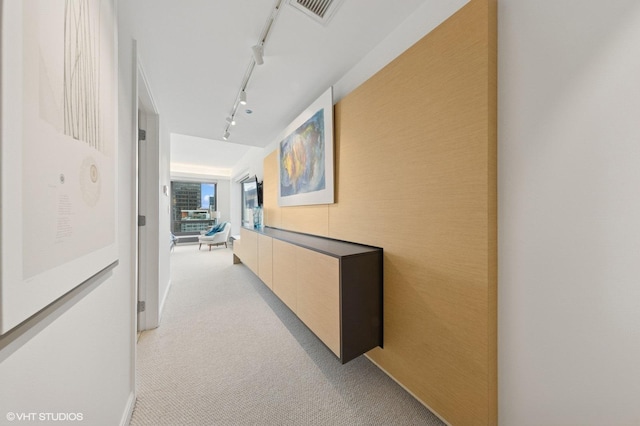 130 N Garland Ct Unit 4101, Chicago, IL 60602 - hallway featuring rail lighting, light colored carpet, and visible vents