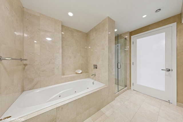 130 N Garland Ct Unit 4101, Chicago, IL 60602 - bathroom with a jetted tub, tile patterned floors, a stall shower, and recessed lighting