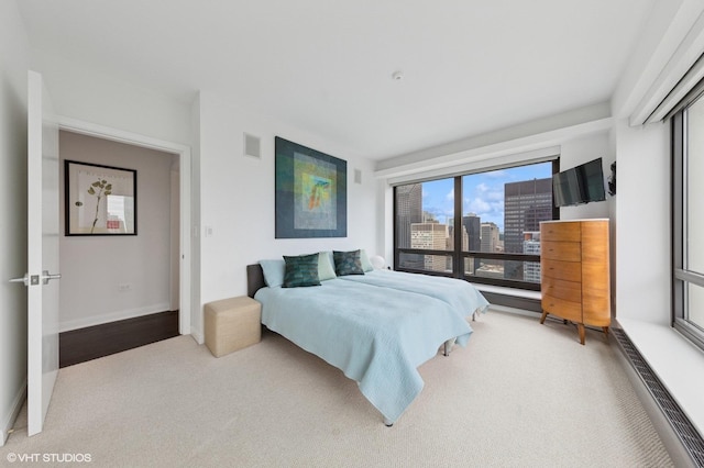 130 N Garland Ct Unit 4101, Chicago, IL 60602 - carpeted bedroom with baseboards, baseboard heating, and visible vents