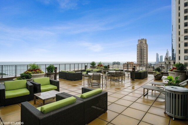 130 N Garland Ct Unit 4101, Chicago, IL 60602 - view of patio / terrace with an outdoor hangout area, a city view, and a water view