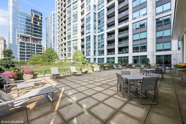 130 N Garland Ct Unit 4101, Chicago, IL 60602 - view of patio / terrace featuring a city view and outdoor dining area