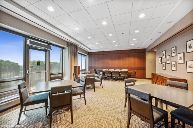 130 N Garland Ct Unit 4101, Chicago, IL 60602 - dining area featuring recessed lighting, wood walls, and light colored carpet
