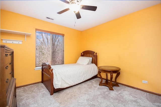 bedroom with light colored carpet and ceiling fan