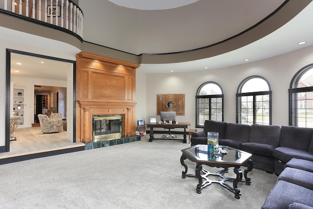 living room featuring a fireplace and light colored carpet