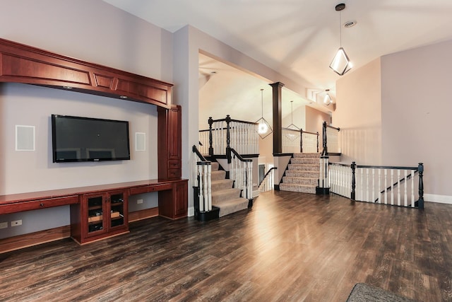 living room featuring high vaulted ceiling and dark hardwood / wood-style floors