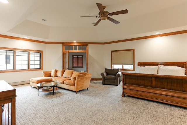 carpeted bedroom with a raised ceiling, ceiling fan, ornamental molding, and baseboard heating