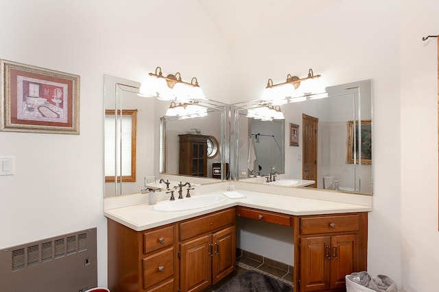 bathroom with vanity, radiator heating unit, and toilet