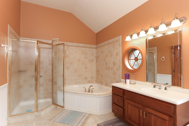 bathroom with lofted ceiling, vanity, tile patterned floors, and plus walk in shower