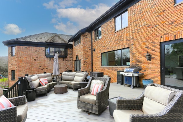 wooden deck featuring area for grilling and outdoor lounge area