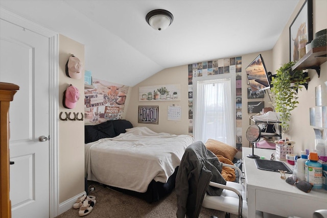 carpeted bedroom with vaulted ceiling