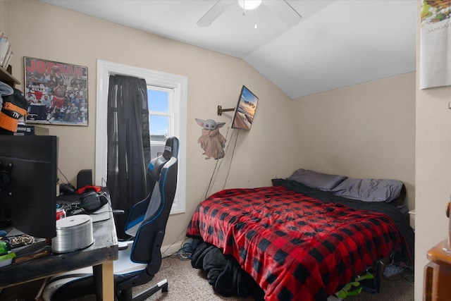 carpeted bedroom featuring lofted ceiling and ceiling fan