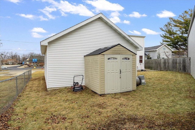 view of outbuilding featuring a yard