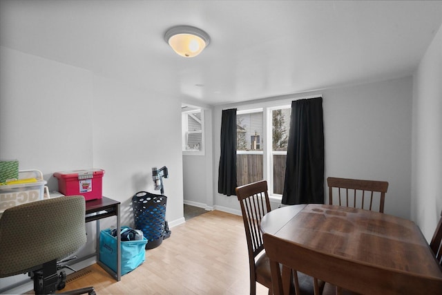 dining area with light hardwood / wood-style floors