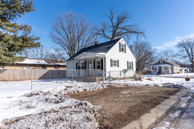 view of front of home featuring a fenced front yard and a porch