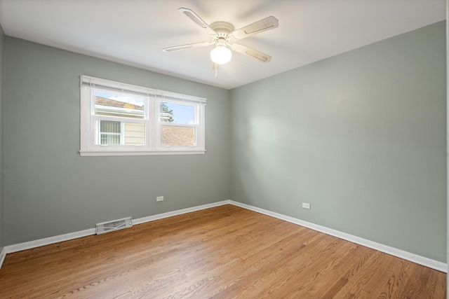 empty room with light hardwood / wood-style floors and ceiling fan