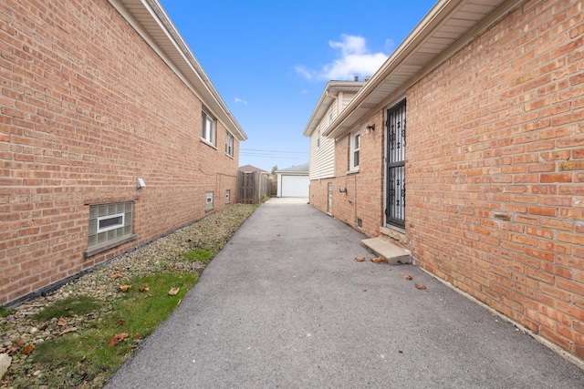 view of home's exterior with an outbuilding and a garage