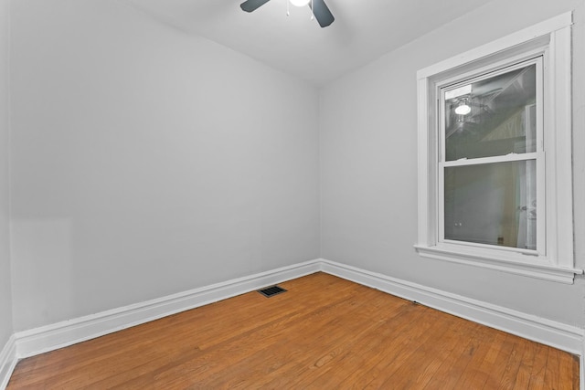 empty room with wood-type flooring and ceiling fan