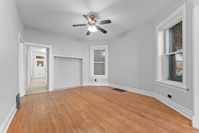 unfurnished bedroom featuring ceiling fan and light wood-type flooring