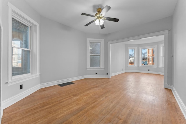 spare room featuring light hardwood / wood-style floors and ceiling fan