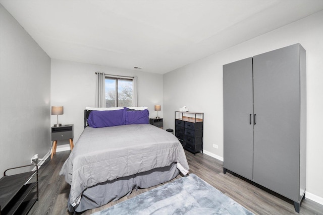 bedroom with hardwood / wood-style floors