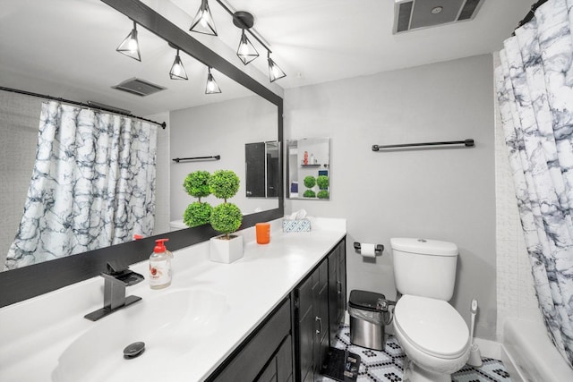 full bathroom featuring vanity, toilet, and shower / bath combo